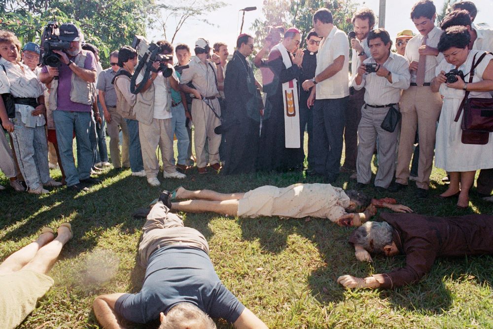 San Salvador Archbishop Arturo Rivera Damas and others view the bodies of those slain at Central American University in El Salvador Nov. 16, 1989. San Salvador Archbishop Arturo Rivera Damas and others view the bodies of those slain at Central American University in El Salvador Nov. 16, 1989.